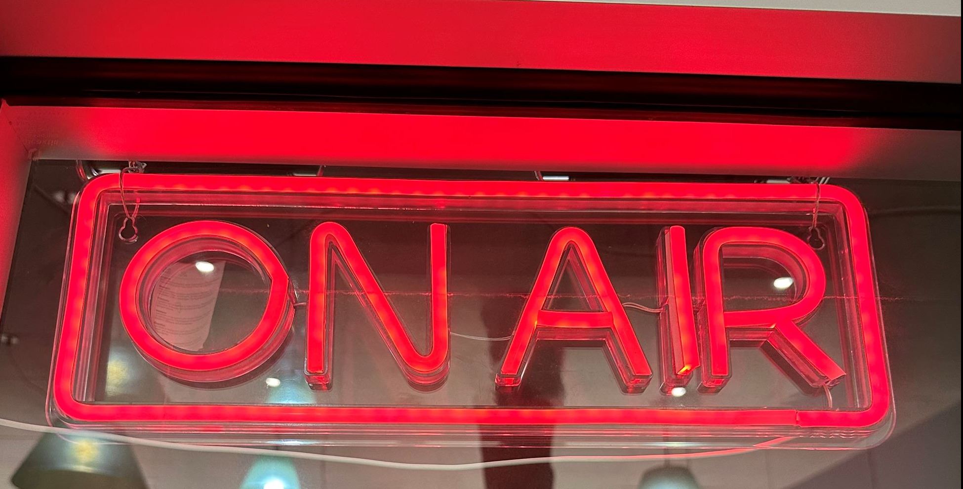 Red neon side that reads "On Air"