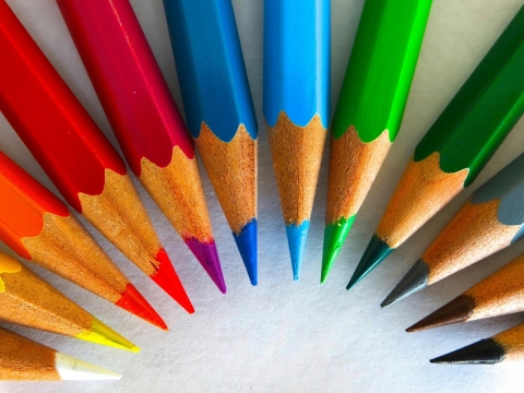 Colored pencils arranged in a semicircle