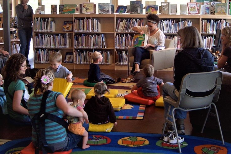 image of librarian reading stories to small children