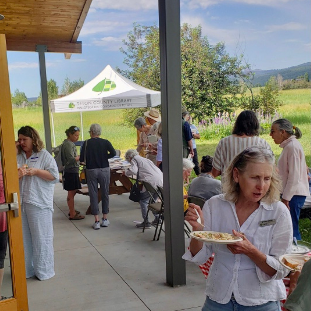 image of people on the patio at Alta Branch, talking and eating