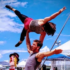 image of two people doing acrobatics