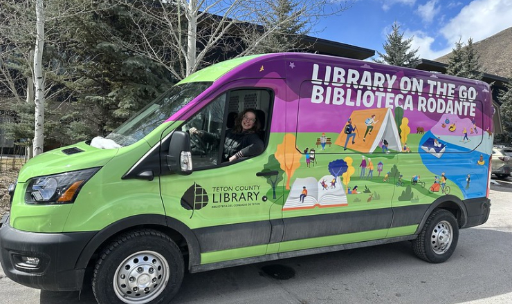 Librarian Anna driving the Outreach Van