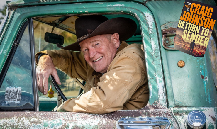 image of Craig Johnson looking out the window of an old pickup truck