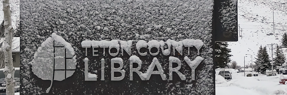 Teton County Library sign covered in snow